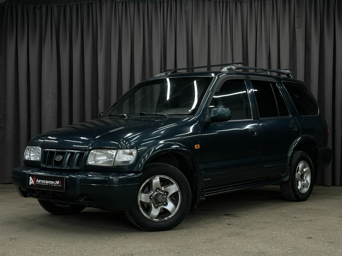 Открыть фотографии: Kia Sportage I