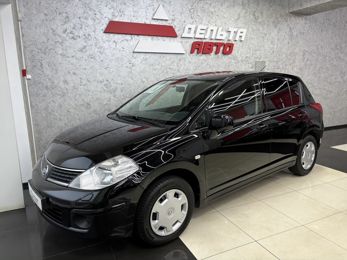 Открыть фотографии: Nissan Tiida I